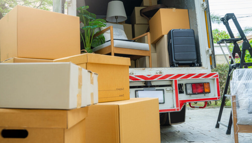 Boxes waiting to be moved into a new home,New home,Moving house day and real estate concept.